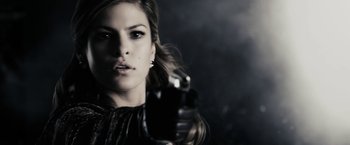 Movie still from “The Spirit” (2008), directed by Frank Miller – A beautiful woman holding a gun in her hand; Close Up shot, Low angle