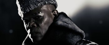 Movie still from “The Spirit” (2008), directed by Frank Miller – A person wearing a fur coat; Close Up shot, Low angle