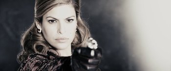 Movie still from “The Spirit” (2008), directed by Frank Miller – A beautiful woman holding a gun in her right hand; Close Up shot, Low angle