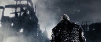 Movie still from “The Spirit” (2008), directed by Frank Miller – A man in a black jacket is standing in the snow; Extreme Close Up shot, Low angle