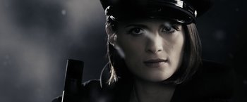 Movie still from “The Spirit” (2008), directed by Frank Miller – A person wearing a hat; Close Up shot, Overhead angle