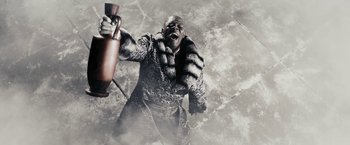 Movie still from “The Spirit” (2008), directed by Frank Miller – An image of a man holding an extinguisher in the snow; Medium shot, Low angle