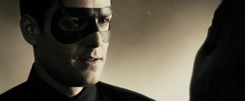 Movie still from “The Spirit” (2008), directed by Frank Miller – A person wearing a mask; Close Up shot, Over the shoulder angle
