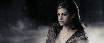 Movie still from “The Spirit” (2008), directed by Frank Miller – A beautiful woman in a black and brown dress; Close Up shot, Low angle