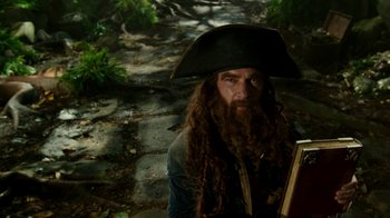 Movie still from “The SpongeBob Movie: Sponge Out of Water” (2015), directed by Mike Mitchell – A man with long hair and a beard wearing a pirate's hat; Close Up shot, Low angle