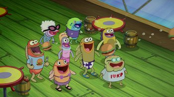 Movie still from “The SpongeBob Movie: Sponge Out of Water” (2015), directed by Mike Mitchell – A group of people standing next to each other on a wooden floor; Wide shot, High angle