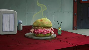 Movie still from “The SpongeBob Movie: Sponge Out of Water” (2015), directed by Mike Mitchell – A hamburger sitting on top of a white plate; Extreme Close Up shot, High angle