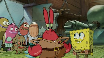 Movie still from “The SpongeBob Movie: Sponge Out of Water” (2015), directed by Mike Mitchell – A group of people standing next to each other in a room; Medium shot, Over the shoulder angle