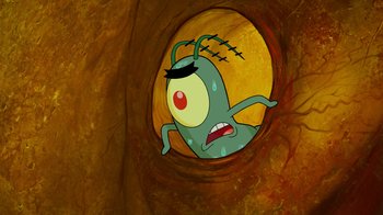 Movie still from “The SpongeBob Movie: Sponge Out of Water” (2015), directed by Mike Mitchell – An animated character is in a hole in the wall; Extreme Close Up shot, High angle