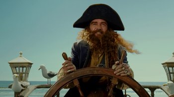 Movie still from “The SpongeBob Movie: Sponge Out of Water” (2015), directed by Mike Mitchell – A man in a pirate hat sitting at the steering wheel of a boat; Close Up shot, Low angle