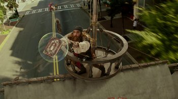 Movie still from “The SpongeBob Movie: Sponge Out of Water” (2015), directed by Mike Mitchell – A man that is riding a ferris wheel; Wide shot, High angle