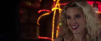Movie still from “The Spy Who Dumped Me” (2018), directed by Susanna Fogel – A person smiling at the camera; Close Up shot, Over the shoulder angle