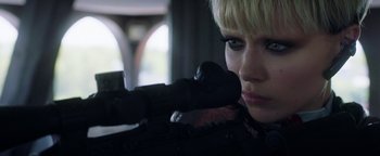 Movie still from “The Spy Who Dumped Me” (2018), directed by Susanna Fogel – A person holding a gun; Close Up shot, Low angle