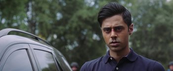 Movie still from “The Spy Who Dumped Me” (2018), directed by Susanna Fogel – A person wearing a blue shirt; Close Up shot, Over the shoulder angle