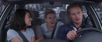 Movie still from “The Spy Who Dumped Me” (2018), directed by Susanna Fogel – A group of people in the back of a car; Medium shot, Over the shoulder angle