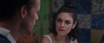 Movie still from “The Spy Who Dumped Me” (2018), directed by Susanna Fogel – A woman looking at another woman in front of a wall; Close Up shot, Over the shoulder angle