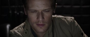 Movie still from “The Spy Who Dumped Me” (2018), directed by Susanna Fogel – A person wearing headphones; Close Up shot, High angle