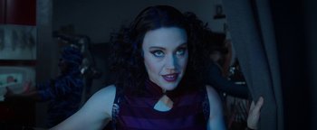 Movie still from “The Spy Who Dumped Me” (2018), directed by Susanna Fogel – A person with long black curly hair; Close Up shot, Over the shoulder angle