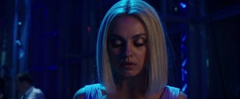 Movie still from “The Spy Who Dumped Me” (2018), directed by Susanna Fogel – A woman with blonde hair is looking down at her face; Close Up shot, Over the shoulder angle