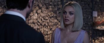Movie still from “The Spy Who Dumped Me” (2018), directed by Susanna Fogel – A woman in a purple dress looking at a man in a black suit; Close Up shot, Over the shoulder angle