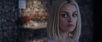 Movie still from “The Spy Who Dumped Me” (2018), directed by Susanna Fogel – A person with short blonde hair; Close Up shot, Over the shoulder angle