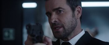 Movie still from “The Spy Who Dumped Me” (2018), directed by Susanna Fogel – A person holding a cell phone; Close Up shot, Over the shoulder angle