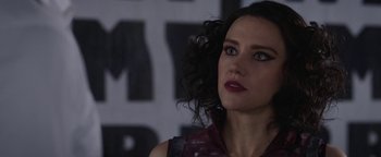 Movie still from “The Spy Who Dumped Me” (2018), directed by Susanna Fogel – A person wearing a dress; Close Up shot, Over the shoulder angle