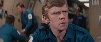 Movie still from “The Spy Who Loved Me” (1977), directed by Lewis Gilbert – A person wearing a blue shirt; Close Up shot, Low angle