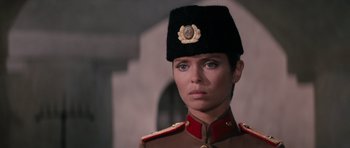 Movie still from “The Spy Who Loved Me” (1977), directed by Lewis Gilbert – A woman in a military uniform wearing a black hat; Close Up shot, Low angle