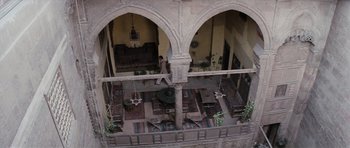 Movie still from “The Spy Who Loved Me” (1977), directed by Lewis Gilbert – An overhead view of a room with a man walking in it; Extreme Wide shot, Overhead angle