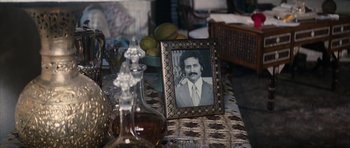 Movie still from “The Spy Who Loved Me” (1977), directed by Lewis Gilbert – A picture frame with a picture of a man on it; Close Up shot, High angle