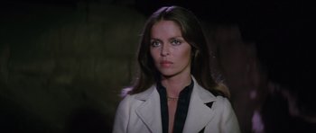 Movie still from “The Spy Who Loved Me” (1977), directed by Lewis Gilbert – A woman with long hair wearing a white jacket; Close Up shot, Low angle