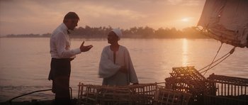 Movie still from “The Spy Who Loved Me” (1977), directed by Lewis Gilbert – Two people talking in front of a body of water; Medium shot, Over the shoulder angle