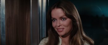 Movie still from “The Spy Who Loved Me” (1977), directed by Lewis Gilbert – A person with long brown hair; Close Up shot, Over the shoulder angle