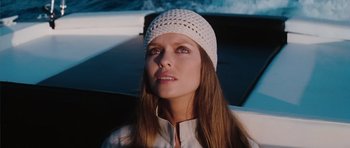 Movie still from “The Spy Who Loved Me” (1977), directed by Lewis Gilbert – A woman with long hair wearing a white hat; Close Up shot, Low angle