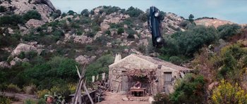 Movie still from “The Spy Who Loved Me” (1977), directed by Lewis Gilbert – A car flying through the air over a building; Extreme Wide shot, High angle