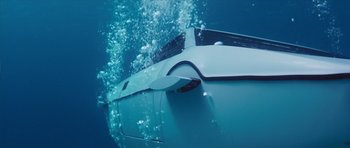 Movie still from “The Spy Who Loved Me” (1977), directed by Lewis Gilbert – A car is submerged in the water; Extreme Wide shot, Overhead angle