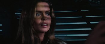 Movie still from “The Spy Who Loved Me” (1977), directed by Lewis Gilbert – A woman's face in a dark room; Close Up shot, Low angle