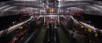 Movie still from “The Spy Who Loved Me” (1977), directed by Lewis Gilbert – A view of the inside of an industrial building; Extreme Wide shot, Overhead angle