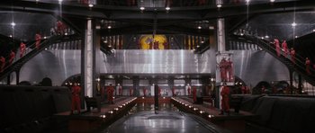 Movie still from “The Spy Who Loved Me” (1977), directed by Lewis Gilbert – A train station that has a lot of lights in it; Extreme Wide shot, High angle