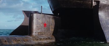 Movie still from “The Spy Who Loved Me” (1977), directed by Lewis Gilbert – A red star on the side of an old boat; Wide shot, Low angle