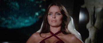 Movie still from “The Spy Who Loved Me” (1977), directed by Lewis Gilbert – A woman with long brown hair wearing a red top; Close Up shot, Low angle