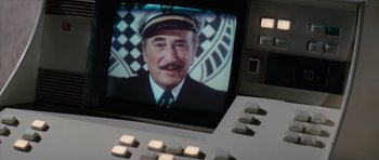 Movie still from “The Spy Who Loved Me” (1977), directed by Lewis Gilbert – A television screen with a picture of a man; Extreme Close Up shot, High angle