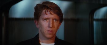 Movie still from “The Spy Who Loved Me” (1977), directed by Lewis Gilbert – A person wearing a black shirt; Close Up shot, Low angle