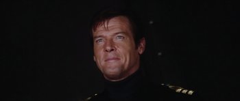 Movie still from “The Spy Who Loved Me” (1977), directed by Lewis Gilbert – A person wearing a black shirt; Close Up shot, Low angle