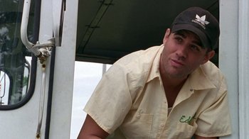 Movie still from “The Station Agent” (2003), directed by Tom McCarthy – A person wearing a hat; Close Up shot, Low angle