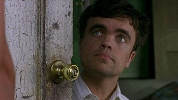 Movie still from “The Station Agent” (2003), directed by Tom McCarthy – A person looking up at a door knob; Close Up shot, Low angle