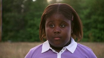 Movie still from “The Station Agent” (2003), directed by Tom McCarthy – A person wearing a purple shirt; Close Up shot, Low angle
