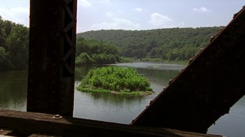 Movie still from “The Station Agent” (2003), directed by Tom McCarthy – A small island in the middle of a river; Extreme Wide shot, High angle