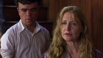 Movie still from “The Station Agent” (2003), directed by Tom McCarthy – A man and a woman standing next to each other; Close Up shot, Over the shoulder angle